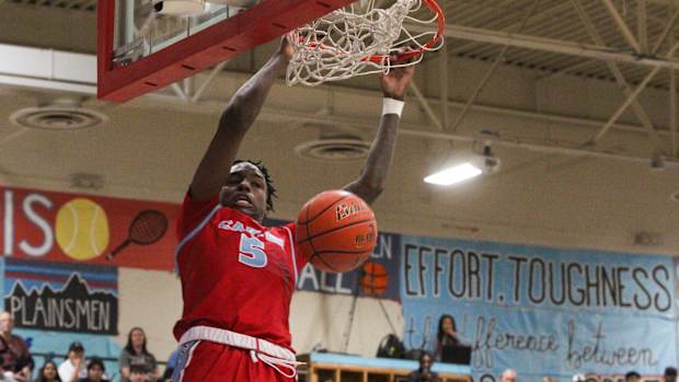 Dallas Carter's Chance Puryear finishes a dunk in a boys basketball game as part of the Caprock Classic on Friday, Dec. 30, 2022 at Monterey High School.